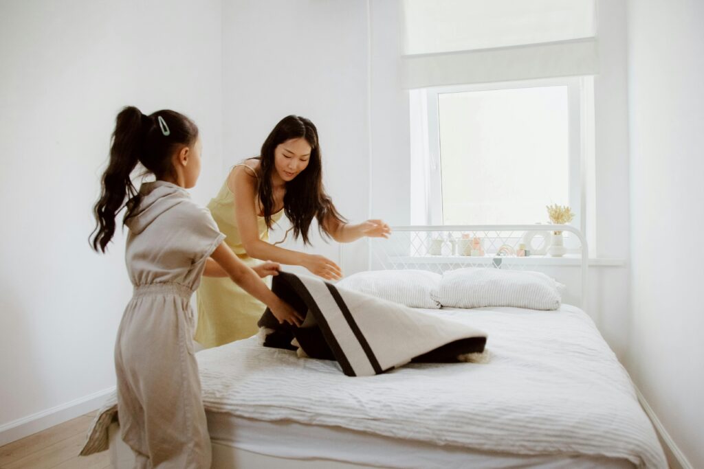 Person deep cleaning a home room by room for a sparkling, fresh look.